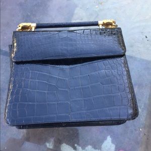 Judith Leiber black crocodile clutch.
